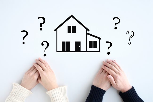 Image of a couple with questions about building a house or buying a home